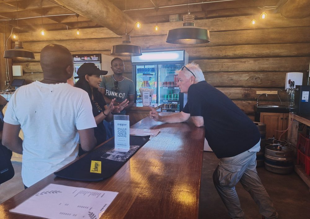 Lisa-Marie Pyanee talking through a scene with the director at the bar location