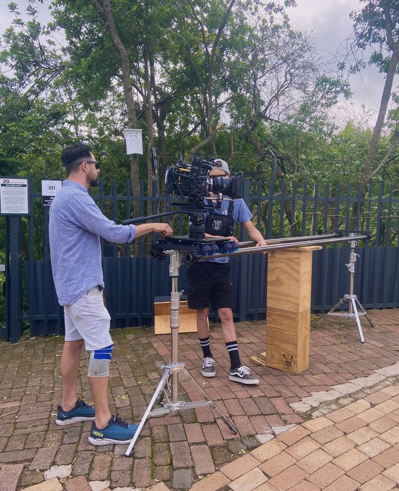 Camera team setting up a slider shot outdoors